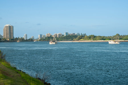 Tweed River and city with prawn boats heading out fishing.1