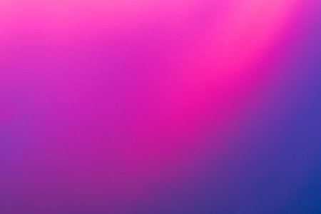 Calm water. surface as sun drops below horizon casting a bright pink hue over the blue forming an abstract background.の写真素材