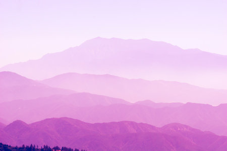 Blue ridge mountain, tiers of mountain ridges stretching into distance under blue skyの写真素材