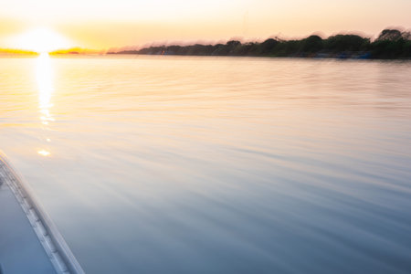 Motion blur background South American river landscape while traveling along river at sunset in the Pantanal Brazil.の写真素材