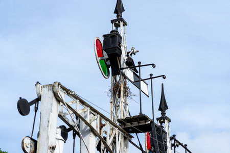 Crow nesting at railway station in semaphore signal equipment.の写真素材