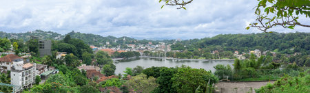 Panorama view over Lake Kandy an artificial lake with the town, Tooth Temple and Old Royal Palace around its perimeter in Sri Lanka.の写真素材