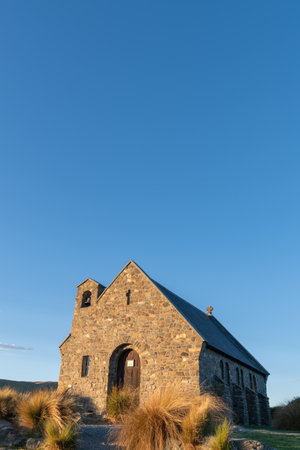 Sun sets on stone front of Church of Good Sheppard in Tekapo., Canterbury New Zealand.の写真素材