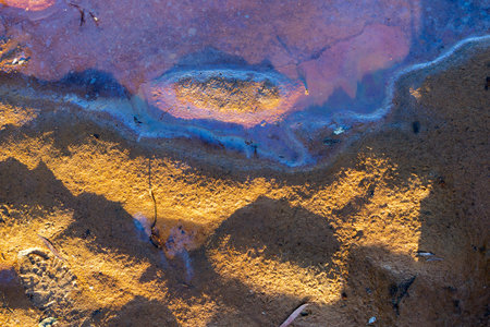 Close-up view of the surface of ripples and shapes in the morning where river has receded.