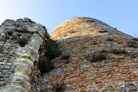 texture of crumbling St Benets Abbey ruins and remains of mill tower and walls closeup.の写真素材