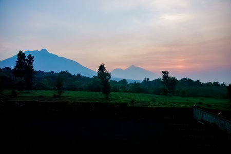 Mountains in silhouette and colourful morning sky in Rwanda.