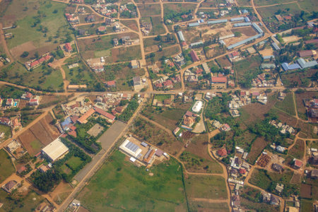Aerial red rooftops below through passenger plane window in flight over Kigali  Rwanda.の写真素材