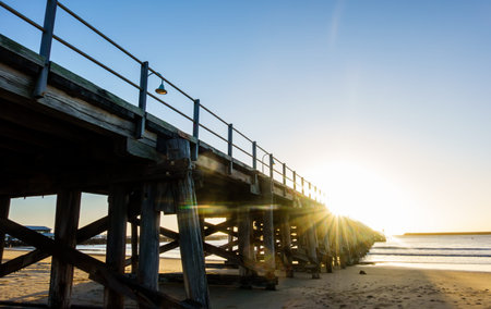Australia Coffs Harbour Pier at sunrise.stretching out towards horizin from beach.の写真素材