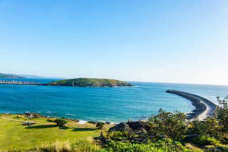 View from Corabirra Point across NSW Australia Coffs Harbour to Muttonbird Island and South Breakwater to Muttonbird Island.の写真素材