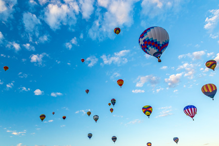 Hot Air Balloons fly over the city of Albuquerque, New Mexico during the mass ascension at the annual International Hot Air Balloon Fiesta in October, 2016のeditorial素材