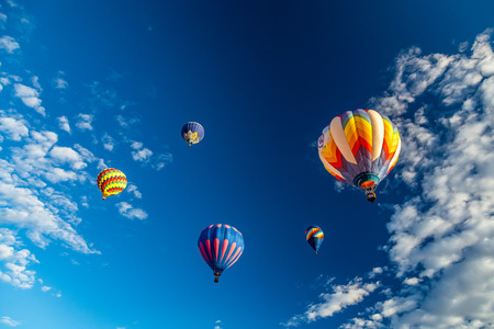 Hot Air Balloons fly over the city of Albuquerque, New Mexico during the mass ascension at the annual International Hot Air Balloon Fiesta in October, 2016のeditorial素材