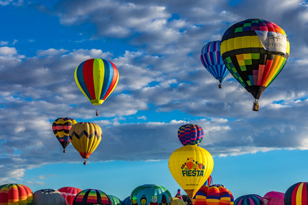 Hot Air Balloons fly over the city of Albuquerque, New Mexico during the mass ascension at the annual International Hot Air Balloon Fiesta in October, 2016のeditorial素材