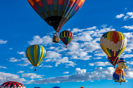 Hot Air Balloons fly over the city of Albuquerque, New Mexico during the mass ascension at the annual International Hot Air Balloon Fiesta in October, 2016のeditorial素材