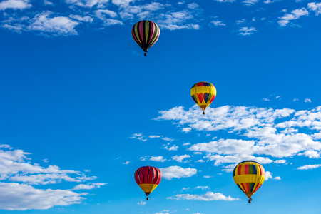 Hot Air Balloons fly over the city of Albuquerque, New Mexicoの写真素材