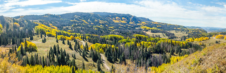 Beautiful mountain scenery with streams, valleys, and color changing trees along a train route from Chama, New Mexico to Antonito, Coloradoの写真素材