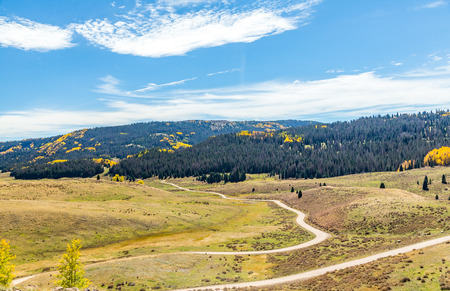 Beautiful mountain scenery with streams, valleys, and color changing trees along a train route from Chama, New Mexico to Antonito, Coloradoの写真素材
