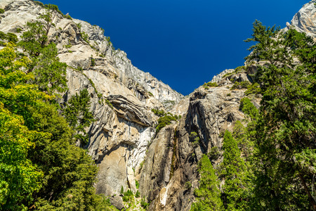 Yosemite Falls is the highest waterfall in Yosemite National Park, dropping a total of 2,425 feet (739 m) from the top of the upper fall to the base of the lower fall. In years of little snow, the falls may actually cease flowing altogether in late summerの写真素材