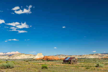 An abandoned log cabin sits neglected in Kodachrome Basin, Utah.の写真素材