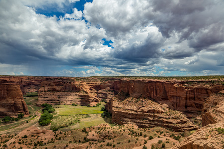 The Canyon de Chelly National Monument consists of many well-preserved Anasazi ruins and spectacular sheer red cliffs that rise up to 1000 feet.の写真素材