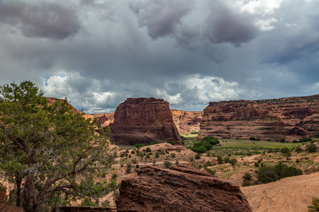 The Canyon de Chelly National Monument consists of many well-preserved Anasazi ruins and spectacular sheer red cliffs that rise up to 1000 feet.の写真素材