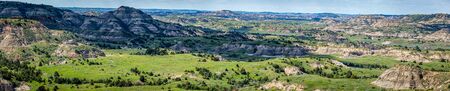 A panoramic view from the Painted Canyon Overlook in the South Unit of Theodore Roosevelt National Park near Medora, North Dakota.の写真素材