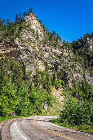 High limestone cliffs line the route of the Spearfish Canyon Scenic Byway in the Black Hills National Forest.の写真素材
