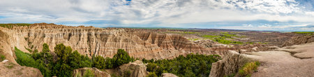 Badlands National Park is located in southwestern South Dakota, featuring nearly 400 square miles of sharply eroded buttes and pinnacles, and the largest undisturbed mixed grass prairie in the United States.の写真素材