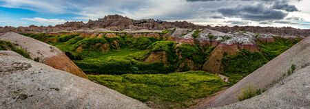 Badlands National Park is located in southwestern South Dakota, featuring nearly 400 square miles of sharply eroded buttes and pinnacles, and the largest undisturbed mixed grass prairie in the United States.の写真素材