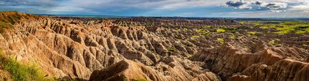 Badlands National Park is located in southwestern South Dakota, featuring nearly 400 square miles of sharply eroded buttes and pinnacles, and the largest undisturbed mixed grass prairie in the United States.の写真素材