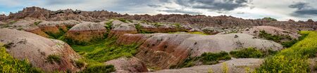 Badlands National Park is located in southwestern South Dakota, featuring nearly 400 square miles of sharply eroded buttes and pinnacles, and the largest undisturbed mixed grass prairie in the United States.の写真素材