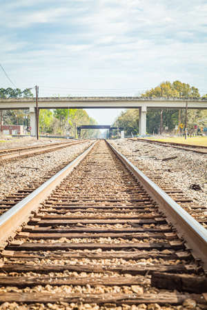 Jesup, GA - March 17, 2018: Double train tracks carry freight and passenger trains through the center of a small town in south Georgia.のeditorial素材