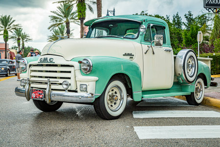 New Smyrna Beach, FL - August 12, 2017: 1954 GMC 100 Stepside pickup truck at the Canal Street Car...