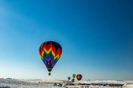White Sands National Monument, NM / USA - September 17, 2016: Colorful hot air ballons take to the sky at the 25th Annual White Sands Hot Air Balloon Invitational.のeditorial素材