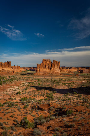 Sandstone rock formations including arches, natural bridges, windows, and pinnacles dominate the...