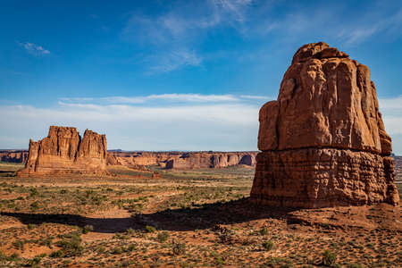 Sandstone rock formations including arches, natural bridges, windows, and pinnacles dominate the landscape at Arches National Park near Moab, Utah.の写真素材