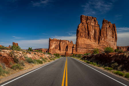 Sandstone rock formations including arches, natural bridges, windows, and pinnacles dominate the landscape at Arches National Park near Moab, Utah.の写真素材