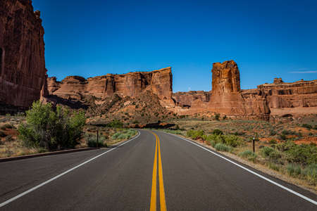 Canyons and eroded sandstone and limestone formations dominate the landscape at Arches National Park nesr Moab, Utah.の写真素材