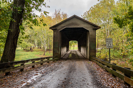 The Middle Road Covered Bridge crosses the West Branch of Conneaut Creek during the Autumn leaf...