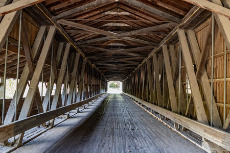 The Harpersfield Covered Bridge, the longest Covered bridge in Ohio, crosses Grand River during the...