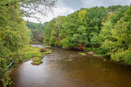 The West Bracnh of Conneaut Creek viewed from the State Road Covered Bridge during the Autumn leaf color change in Ashtabula County, Ohio.の写真素材