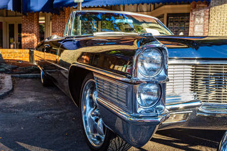 Fernandina Beach, FL - October 18, 2014: Low perspective close up front corner view of a 1965 Cadillac Coupe de Ville convertible at a classic car show in Fernandina Beach, Florida.のeditorial素材