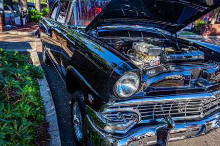 Fernandina Beach, FL - October 18, 2014: Wide angle low perspective front corner view of a 1956 Ford Mainline Tudor sedan at a classic car show in Fernandina Beach, Florida.のeditorial素材