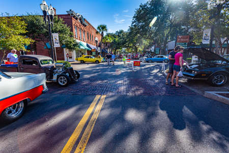 Fernandina Beach, FL - October 18, 2014: Wide angle view of a classic car show taking place on a downtown street in Fernandina Beach, Florida.のeditorial素材