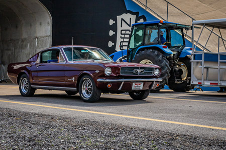 Lebanon, TN - May 14, 2022: Wide angle front corner view of a 1965 Ford Mustang Fastback leaving a local car show.のeditorial素材