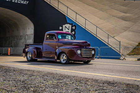 Lebanon, TN - May 14, 2022: Wide angle front corner view of a customized 1950 Ford F1 Pickup Truck leaving a local car show.のeditorial素材