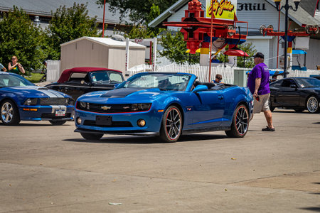 Des Moines, IA - July 03, 2022: Wide angle front corner view of a 2013 Chevrolet Camaro SS Convertible driving on a road.のeditorial素材