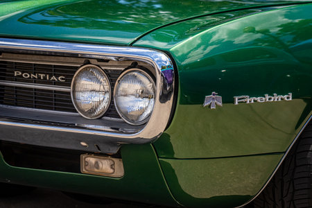 Des Moines, IA - July 03, 2022: Close up detail view of a 1968 Pontiac Firebird 400 Hardtop Coupe front fender & headlights at a local car show.のeditorial素材