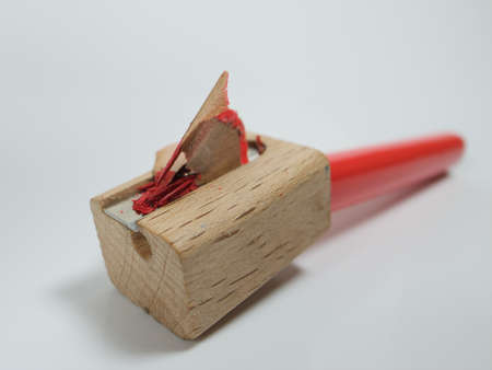 red pencil crayon in a pencil sharpener の写真素材