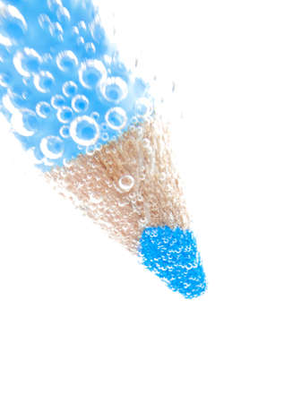Blue pencil crayon on white background with bubblesの写真素材