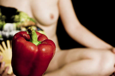 red pepper on out of focus femaleの写真素材